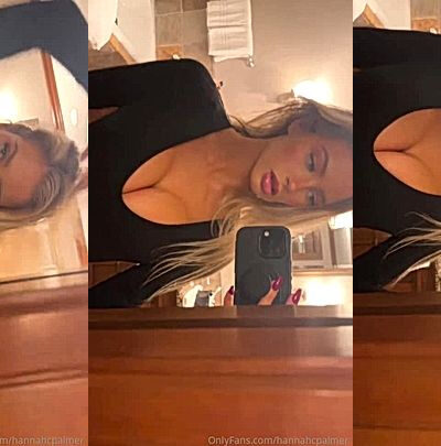 Hannah Palmer showing off her deep cleavage in the mirror