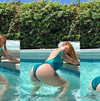 redhead babe Emma Magnolia shaking her big booty in the pool