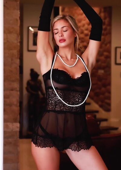 blonde super model Hannah Palmer in black lingerie and pearls