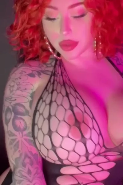 Bishoujomom teasing her big tits in her fishnet bodysuit