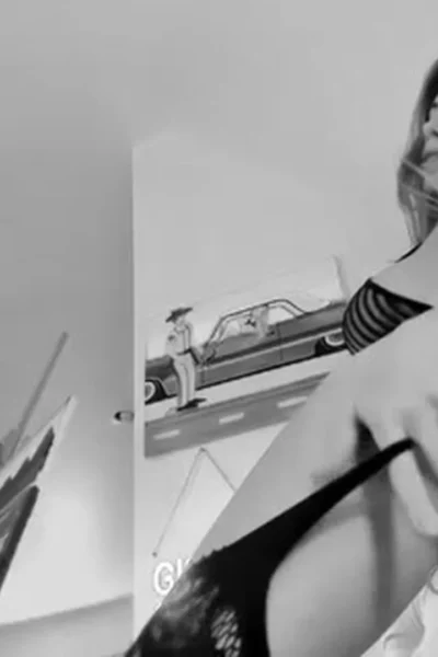 Coconut Kitty teasing her sexy body in her black lingerie