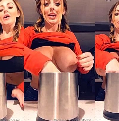 Sexy Slut Sophie Dee teasing her big tits in the kitchen