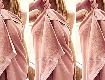 Katiegcups teasing her wet naked body from her bathrobe