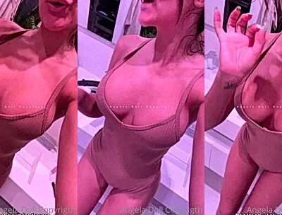 Angela doll teasing her naked big tits in the bathroom