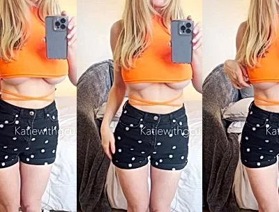 Katiegcups teasing her big tits in her short skirt