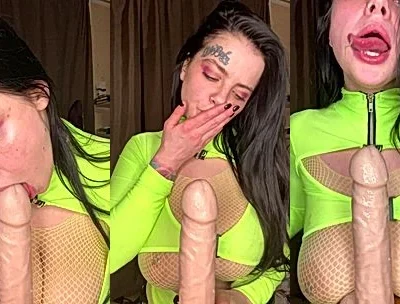 Natalia Polyakova sucking a big dildo in her green bodysuit