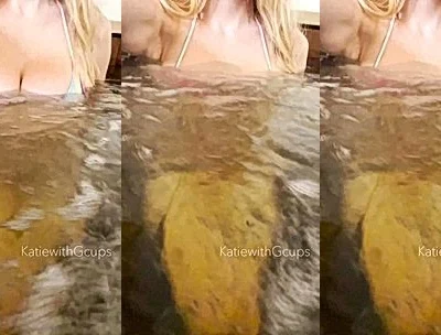 Katiegcups showing off her naked tits in the hot tub