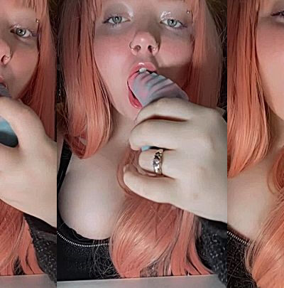 Christi Spooks giving an alien dildo a sloppy blowjob