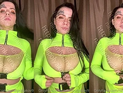 Natalia Polyakova teasing her big tits in her green bodysuit