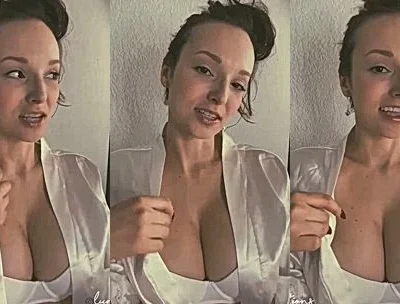 Lexi Luna teasing her deep cleavage in her white dress