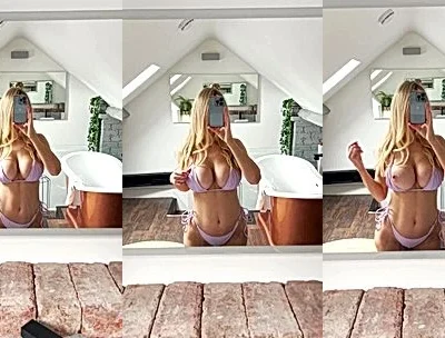 Katiegcups flashing her naked tits in the bathroom mirror
