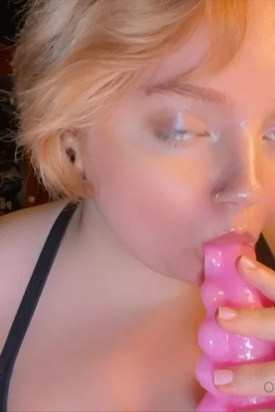 Christi Spooks sucking on her favourite pink dildo