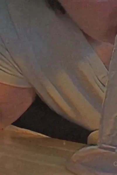 Christi Spooks sucking on a big clear dildo
