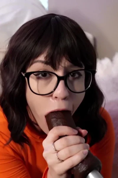 horny velma Heatherbby sucking on a big black dildo