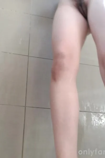Delightfulhug teasng her naked wet pussy in the shower