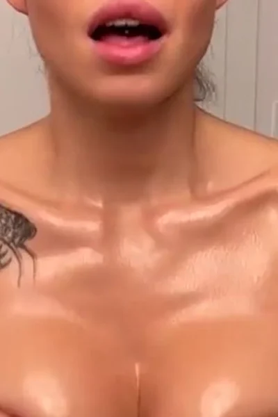 Sonya Jess teasing her naked oiled-up big boobies