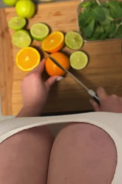 Busty Ema teasing her big tits while cutting vegetables