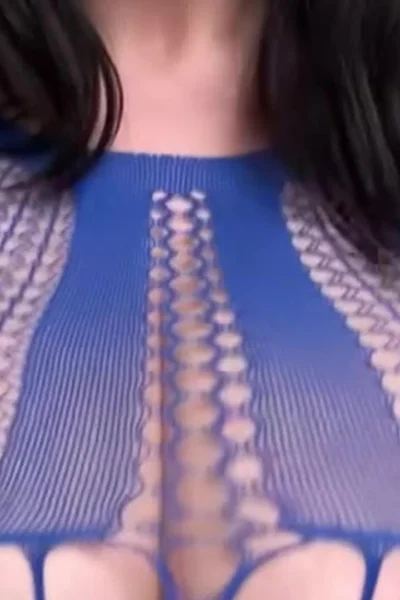 Busty Ema teasing her naked big tits in blue mesh bodysuit