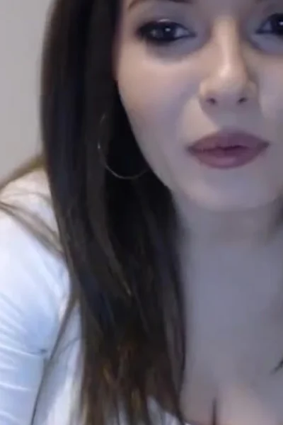 beautiful Romanian chick Busty Ema teasing her big tits in her white see-through shirt