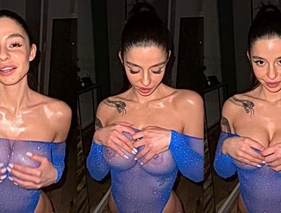 Sonya Jess playing with her big tits in blue fishnet bodysuit