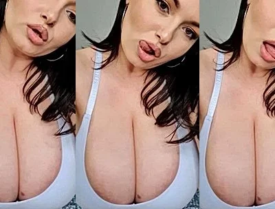 Busty Ema teasing her big tits in tight top