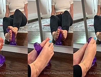 Sams soles21 playing with her purple dildo with feet