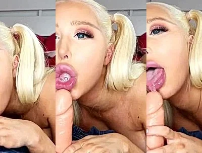 Amanda Toy sucking on a dildo in her red lingerie