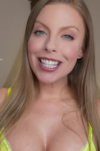 Britney Amber teasing her big tits in yellow lingerie