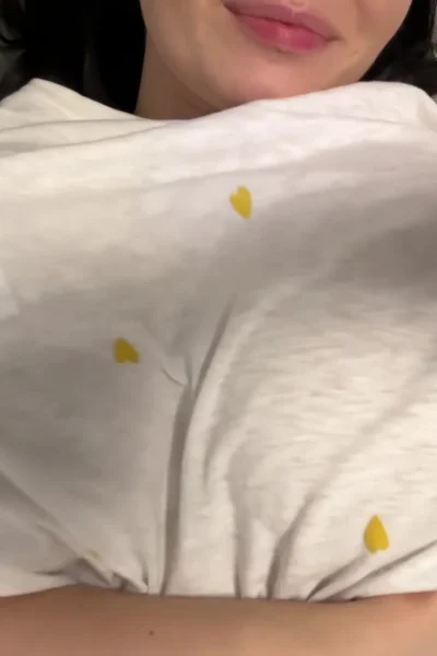 horny girl Busty Ema teasing her big tits in her white top