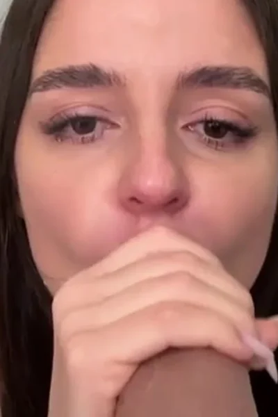 beautiful Ukranian girl Sonya Jess sucking a big dildo on her knees