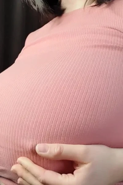 Busty Ema playing with her nipples in pink top